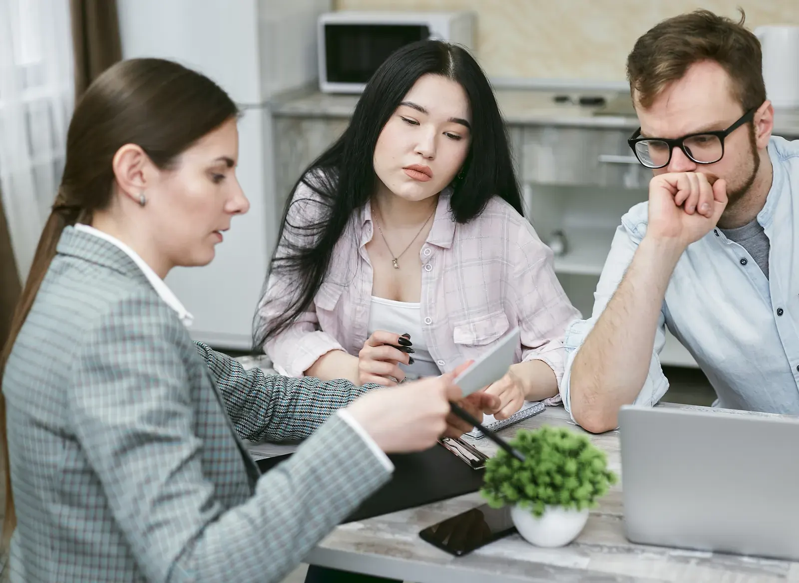 A diverse group of professionals collaborating during an office meeting.